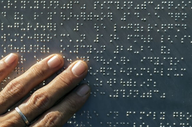 hand touching braille